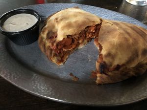 Vegan Vindaloo Pasty with tahini dipping sauce at Cornish Pasty Co in Flagstaff