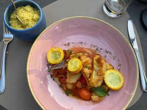Safran couscous with baked tomatoes and breaded  and baked zucchini   at Bahnhöfli in Haag