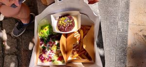Take away bag with salad, hot dog, fries and a brownie at Gurou Street Food in La Rochelle