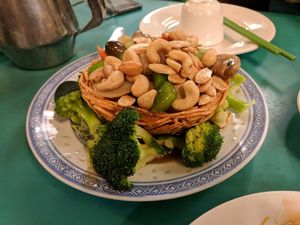 Golden Nest - crispy potato bowl filled with cashews and veggies at Lucky Creation Vegetarian in San Francisco