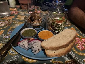 The Minimal (vegan) featuring the tofu balls (SO good), pesto, curry sauce, homemade bread, dragon fruit, fresh salad  at Potato Cafe & Kitchen in Koh Lanta