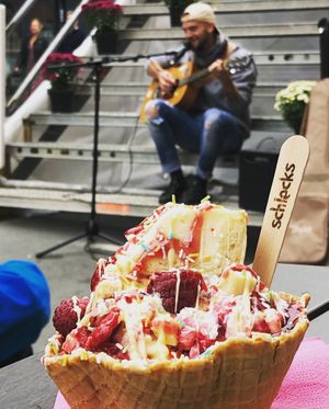 Vanilla Ice Cream, vegan Cheesecake, Raspberries, vegan nougat crisp and Raspberry Sauce on top.  at Schlecks in Muenster