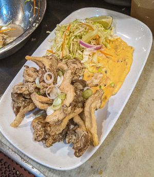 Deep fried oyster mushrooms w/ coleslaw & garlic aioli remoulade. at Millennium in Oakland