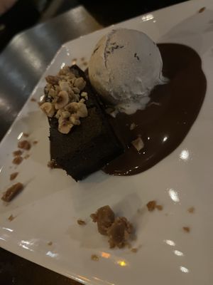 Mochi Brownie w/ Hazelnut Oat Crumble, Frangelico Tcho milk chocolate sauce, coconut cacao nib ice cream, cashew butter toffee  at Millennium in Oakland