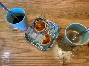 Coffee and vegan pastel de nata   at Izzy's Market Vegetarian Boutique in Vila Do Bispo