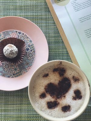 Energy ball and cappuccino  at Izzy's Market Vegetarian Boutique in Vila Do Bispo