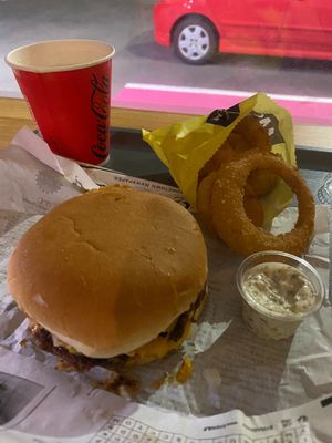 Smash burger & onion rings.  at Junkyard in Reykjavik