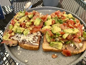 Vegan mollete - toast with avocado, refried beans, pico de gallo and vegan cheese.   at Yah-Yah in Sayulita