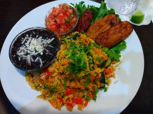 Rice with veggies. Comes with salsa, black beans and I upgraded to plantains instead of salad. I also got vegan cheese on the black beans. at Lapa's Costa Rican Bistro in Bonita Springs