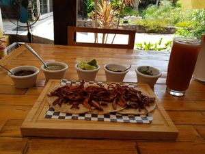 Tacos de tripa (setas tostadas) con frijolitos, cebollita, chile, limón y cilantro. at Blooming Onion - Moctezuma in Guadalajara