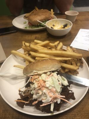 Sante fa chicken, bacon mac n cheese, pulled pork burger (top to bottom) at Veggie Grill by Next Level - River North in Chicago