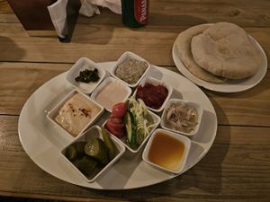 Hummus, pita, sides and sauces with Falafel plate at Falafel Bocas Sababa in Bocas Del Toro