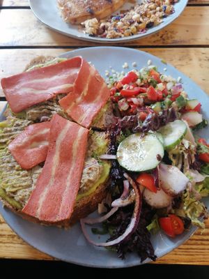 Sandwich with avocado and baba ganoush, tabouleh salad, and vegan bacon. at Preps in Maastricht