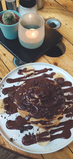 Yummy vegan pancakes with banana and chocolate sauce. at Preps in Maastricht