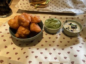 Cauliflower wings (with vegan sourcream and additional guacamole)  at Burgerheart in Wurzburg