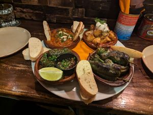 Spinach and chickpea curry, potatas bravas, padron peppers and vine leaves at The Square Orange in Keswick