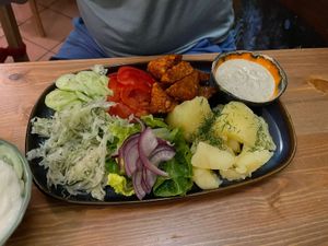 Tempeh with potatoes and salads  at no bones in Krakow