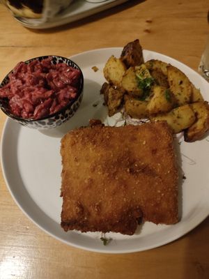 Schabowy cutlet, potatoes and fried beetroot at no bones in Krakow