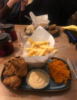 fried oysters and fish in the background   at no bones in Krakow