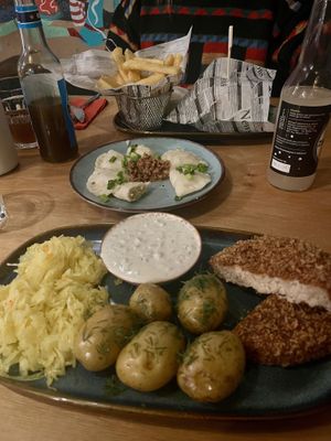 Boneless fish, pierogies and burger. SO GOOD 🤤  at no bones in Krakow