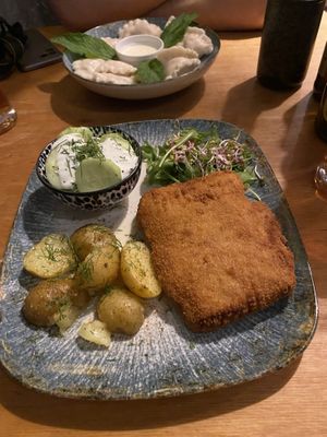 “Pork” chop, cream cucumber salad and potatos  at no bones in Krakow
