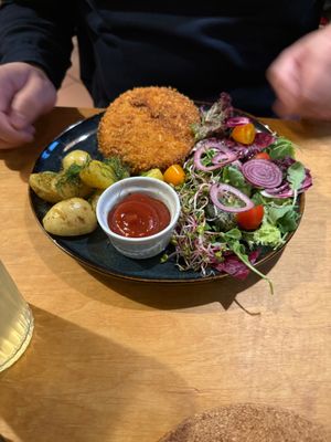 Schnitzel with potatoes and salad  at no bones in Krakow