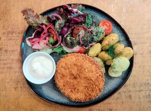 NO CHICKEN
PANKO-CRUSTED PLANT-BASED "CHICKEN" CUTLET, POTATOES, SUMMER SALAD (MIXED GREENS, CHERRY TOMATOES, CUCUMBER, RED ONION, BLACK SESAME DRESSING), TARTARE at no bones in Krakow
