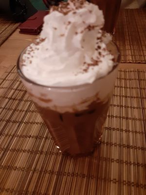 Iced latte with whipped cream at no bones in Krakow