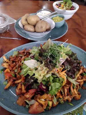 Mushroom salad and potato with miso sauce and guacamole at Kartoffelhaus in Freiburg