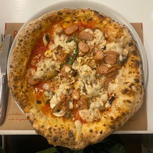 Pizza Boscaiola: Roma tomatoes, mozzarisella, vegetable "sausage," mushroom mix, basil and rosemary cannellini bean waffle.
 at Rossopomodoro in Padua