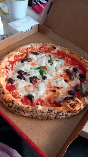 Veg margherita pizza with olives at Rossopomodoro in Padua