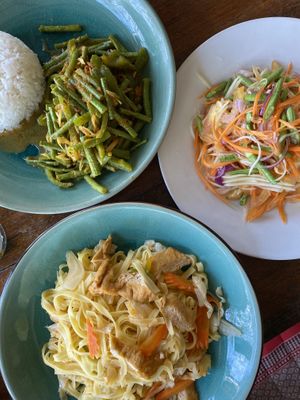 Fried noodles, papaya salad and cha kadao  at Robinson Bungalows in Sihanoukville