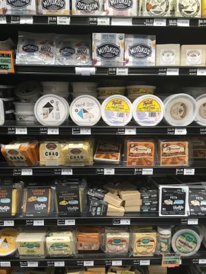 A wall of vegan cheese at Rainbow Grocery in San Francisco