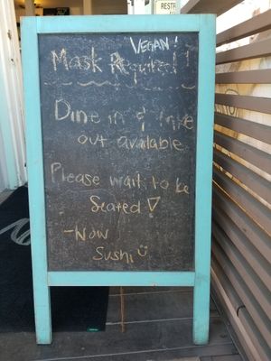 Sign at the door at NoW Sushi in San Diego