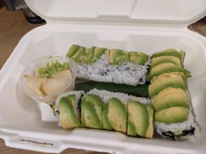 Avocado & cucumber rolls, server on a banana leaf at NoW Sushi in San Diego