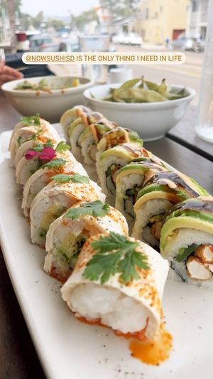 Marilyn roll on the left, Rocky on the right, garlic edamame in the background.   at NoW Sushi in San Diego