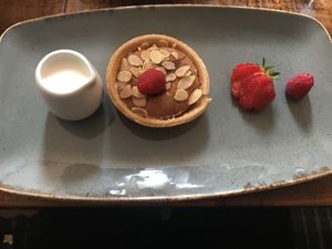 Raspberry and almond tart with soya cream  at The Swan Inn in Skipton
