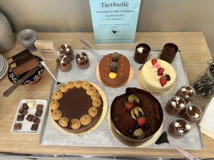The big dark chocolate cake and the two smaller ones in the upper right corner are the vegan options  at Chokladfabriken in Stockholm