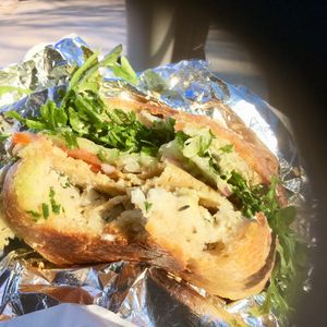 Muffuletta, by Roughage Eatery on Eadha sourdough bun. at Eadha Bakery Worker Co-op in Winnipeg