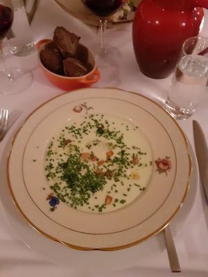 Starter of potato and leek soup, with truffle pieces and truffle ravioli at Pihlkjær in Aarhus
