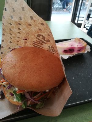 A burger with a vegan cheesecake at Swing Kitchen - Schwedenplatz in Vienna