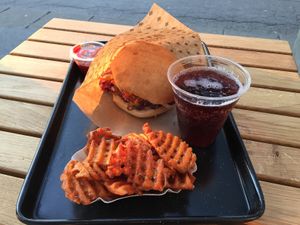 Cheeseburger meal with sweet potato fries and a cherry soda at Swing Kitchen - Schwedenplatz in Vienna