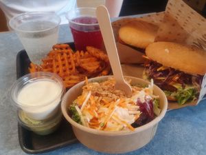 Burgers, Fries and Cole Slaw Salad at Swing Kitchen - Schwedenplatz in Vienna