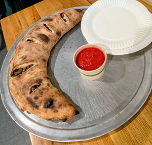 Giant calzone with meatball crumbles, peppers, and mushrooms at 20th Street Pizza in Philadelphia