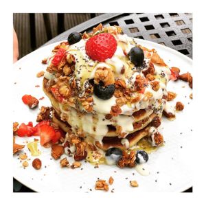 Pancakes, berries, granola & yogurt  at The Carrot's Tail in Rathmines