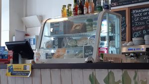 Cheeses for sale at counter at The Carrot's Tail in Rathmines