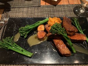 Vegan “surf and turf” (trumpet mushroom “scallops” and “prime rib” from Herbivorous Butcher) at Cosmos in Minneapolis