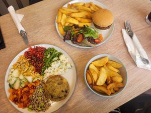 Platter: 'Fish' Cake Served With A Selection Of Salads, Bistro Burger, Chips and Salad and Side of Chips at Dragonfly Bistro in Aberystwyth