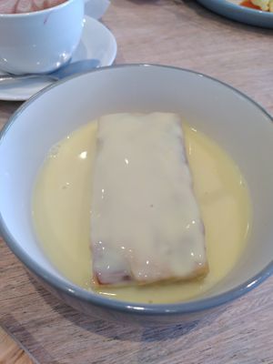 Rhubarb cake with custard (May 2024) at Dragonfly Bistro in Aberystwyth