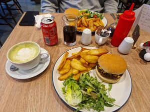 2 Bistro burgers, one with vegan cheese and one with dairy cheese, and a soya matcha latte and a cola. at Dragonfly Bistro in Aberystwyth
